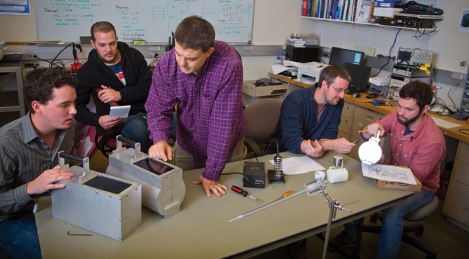 researchers working in lab